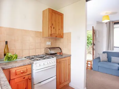 a kitchen with a stove and a counter top at Byre in Saint Martin