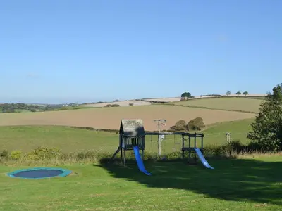 a playground in the middle of a field at Smithy in Saint Martin
