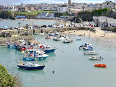 a group of boats are docked in a harbor at Little Owl Lodge in Saint Columb Major