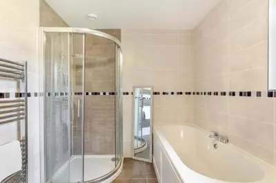 a bathroom with a bath tub and a shower at 2 Bed in Winnards Perch oc-s29311 in Saint Columb Major