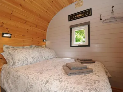 a bedroom with a bed in a room with a window at Hornbeam in Launceston