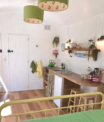 a kitchen with a sink and a counter top at Shepherd's hut at Rosewood House in Liskeard