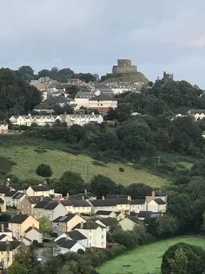 a town on a hill with a castle on top at Hillside Launceston Cornwall in Launceston