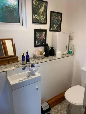 a bathroom with a sink and a toilet at Hillside Launceston Cornwall in Launceston