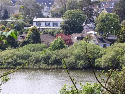 a view of a river with houses and trees at Lake View in Falmouth