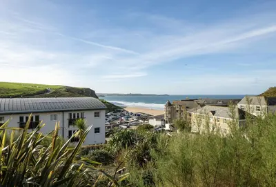 a view of a coastal town with a beach at 3 Waves in Newquay