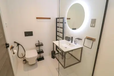 a bathroom with a sink and a mirror at 17 Cliff Edge in Newquay