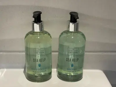 two bottles of soap sitting on top of a sink at Guest Room with Parking Near St Ives & Penzance in Penzance