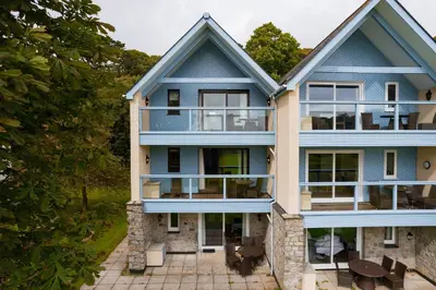 an aerial view of a house with blue at Golf View 80 in Camborne