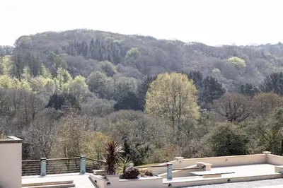 a house with a view of a mountain at Cosy Couples Getaway - The Nook, set in 6 acres of private grounds in Truro