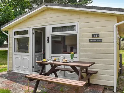 a picnic table in front of a shed at Trevose Head - Uk47556 in St Merryn
