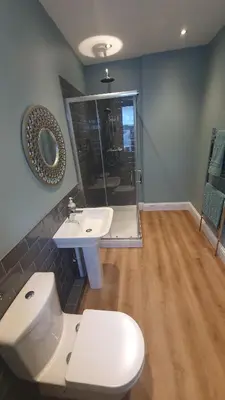 a bathroom with a toilet and a sink at Driftwood in Looe River view and parking in Looe