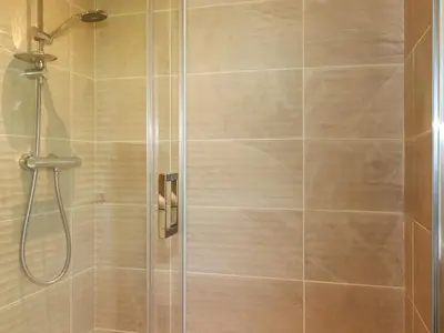 a shower stall with a glass shower door at 43 The Maples in St Austell