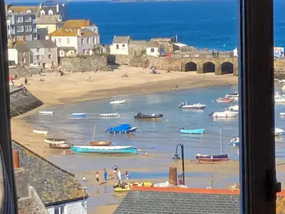 a view of a beach with boats in the water at Admiral Cottage in St Ives