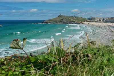 a view of a beach with the ocean at Admiral Cottage in St Ives