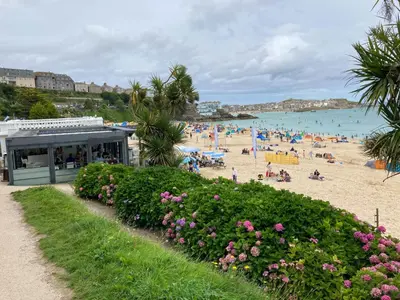 a beach with a bunch of people on it at Admiral Cottage in St Ives