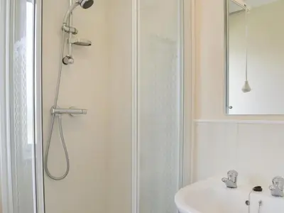 a bathroom with a shower and a sink at Stepper Point - Uk47568 in St Merryn