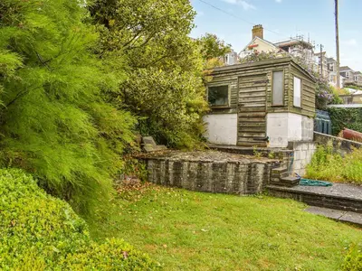 an old house in the middle of a yard at Trethvor in Perranporth
