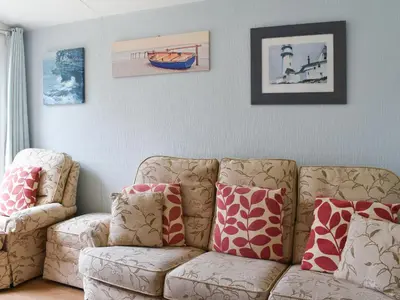 a living room with a couch and two chairs at Gunner Head - Uk47557 in St Merryn