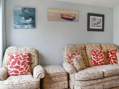 a living room with two chairs and a couch at Gunner Head - Uk47557 in St Merryn