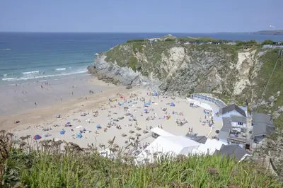 a beach with a bunch of people on it at Sea Breeze, Newquay in Newquay