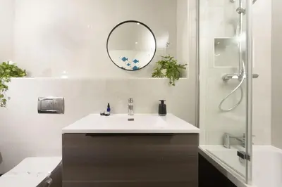 a bathroom with a sink and a mirror at Sea Breeze, Newquay in Newquay