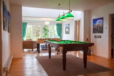 a living room with a pool table in it at Birdsong in Carbis Bay