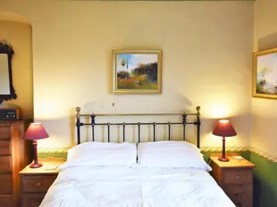 a bedroom with a bed with two lamps on night stands at 3 Bed in Polruan oc-pc032 in Fowey