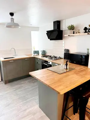 a kitchen with a wooden counter top in a room at 13 WinterSlow Cottage in St Ives