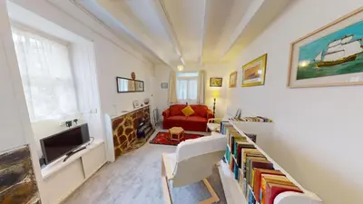 a living room with a couch and a tv at St Ives Gazelle Cottage 2 Bedrooms in St Ives