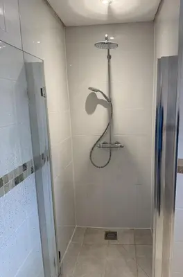a shower in a bathroom with a glass door at Wadebridge, 14 St Matthews Hill in Wadebridge