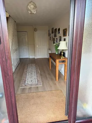 a living room with a table and a lamp at Wadebridge, 14 St Matthews Hill in Wadebridge