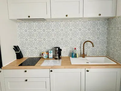 a kitchen counter top with a sink and a counter top at St Ives apartment less than 5 minutes walk to beach parking available in St Ives