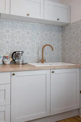 a kitchen with white cabinets and a sink at St Ives apartment less than 5 minutes walk to beach parking available in St Ives