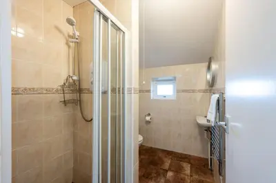 a bathroom with a shower and a sink at Stradav in Polzeath