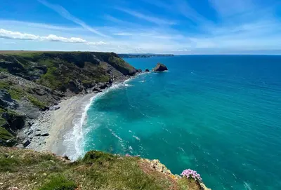 an aerial view of a beach and the ocean at Bowjy Cottage in St. Agnes