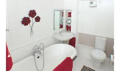 a white bathroom with a sink and a toilet at Seven Bed and Breakfast in St. Agnes