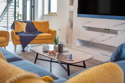 a living room with a couch and a coffee table at 4 Bed in Windmill oc-w29654 in St Merryn