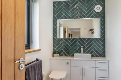 a bathroom with a sink and a mirror at 4 Bed in Windmill oc-w29654 in St Merryn