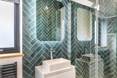 a bathroom with a sink and a toilet and a mirror at 4 Bed in Windmill oc-w29654 in St Merryn