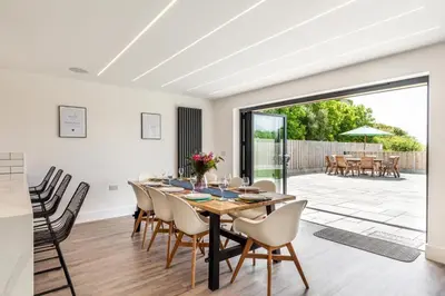 a dining room with a table and chairs at 4 Bed in Windmill oc-w29654 in St Merryn