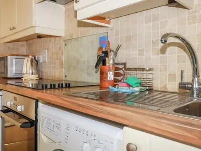a kitchen with a sink and a counter top at Bray Cottage in Bodmin