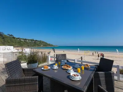 a table with food on it on the beach at Seaspray in St Ives