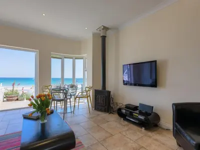 a living room with a view of the ocean at Seaspray in St Ives