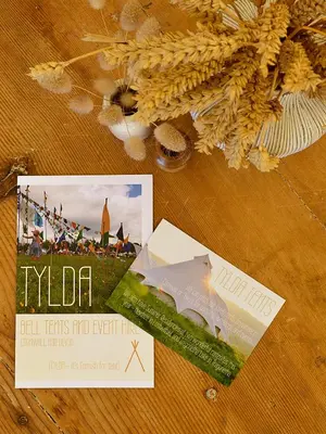 a book and a magazine on a table at Tylda Tents at Heydaze Campsite - 5m Luxury Bell Tent 
