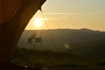 a view of the sunset from a tent at Tylda Tents at Heydaze Campsite - 5m Luxury Bell Tent 