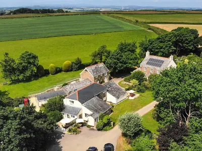 an aerial view of a house with a yard at The Linney-Uk12576 in Bodinnick