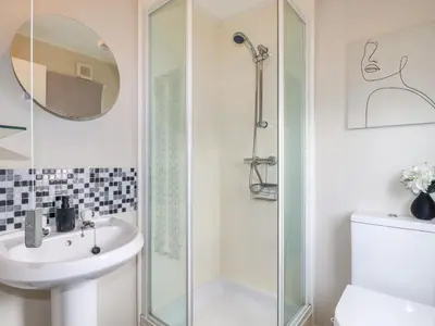 a bathroom with a shower and a sink at Lowen Lodge in Padstow