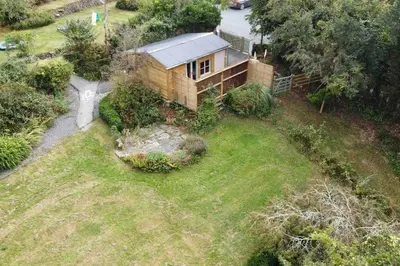 an aerial view of a house in a yard at The Garden Room - Cabin on The Lizard in Cury