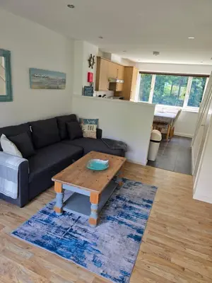 a living room with a couch and a coffee table at Seven Bays in Newquay